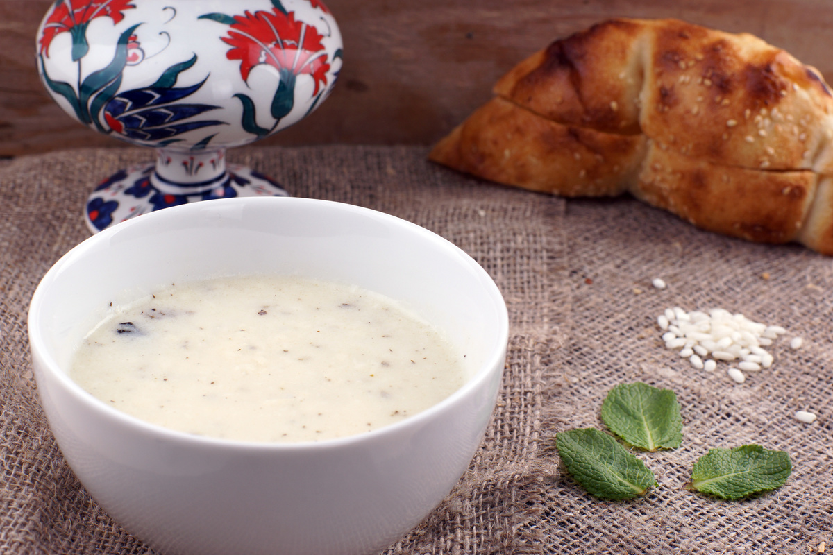 Turkish national rice soup with mint in a white plate